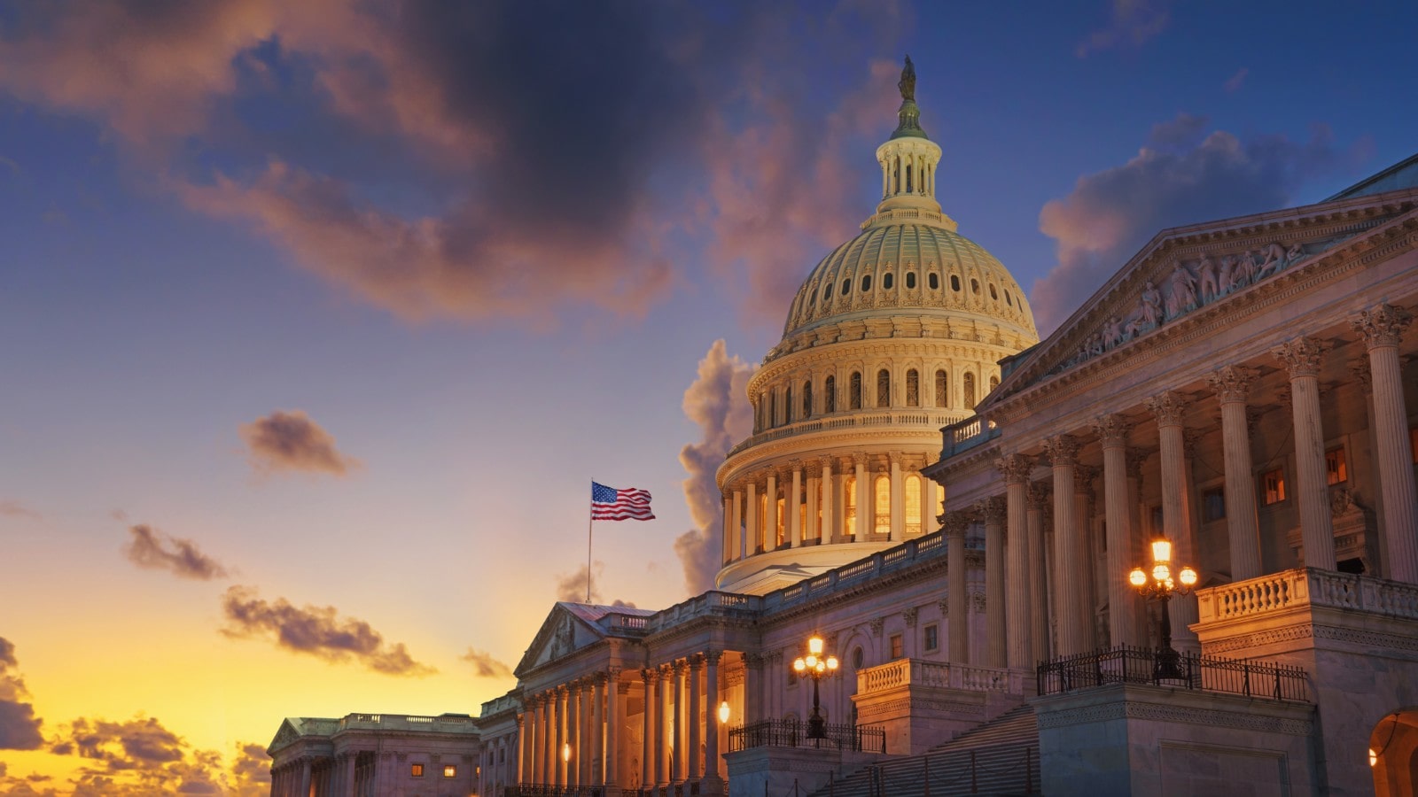 United States Capitol with a flag on top